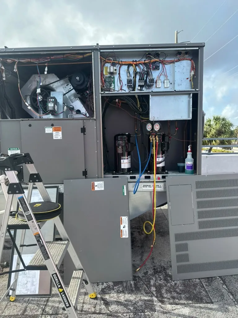 Open commercial air conditioning unit during technical service